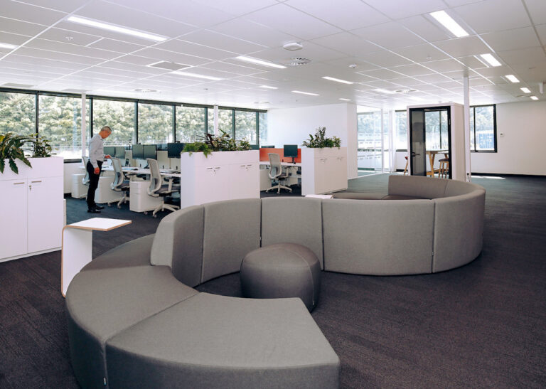 ACCO office interior with collaborative seating and open-plan work areas overlooking the windows.