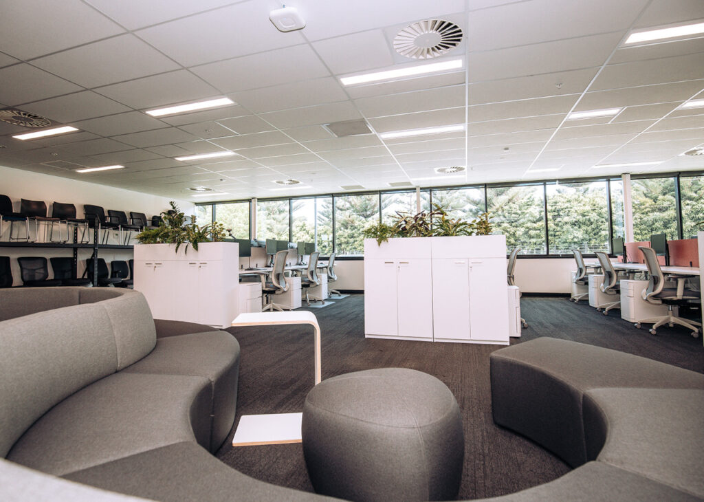 ACCO office interior with collaborative seating and open-plan work areas overlooking the windows.