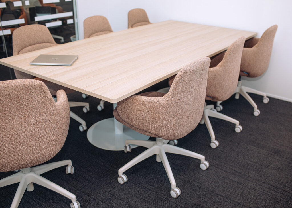 Meeting table with upholstered Buro chairs in the ACCO workplace showroom.