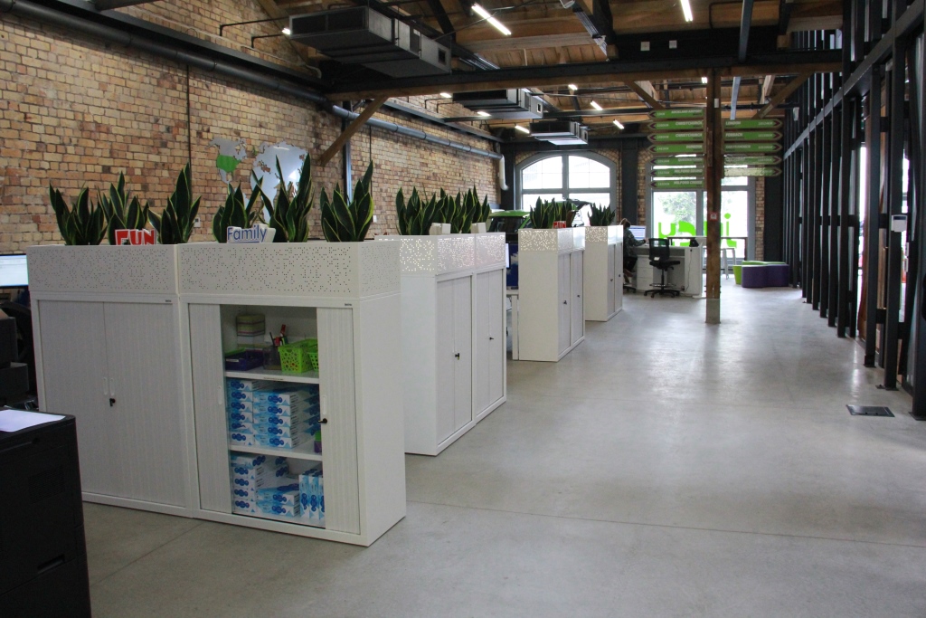 Open-plan workplace designed for JUCY Rentals