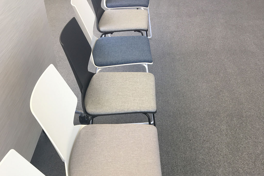 Upholstered visitor seating in the Diplomat Global office