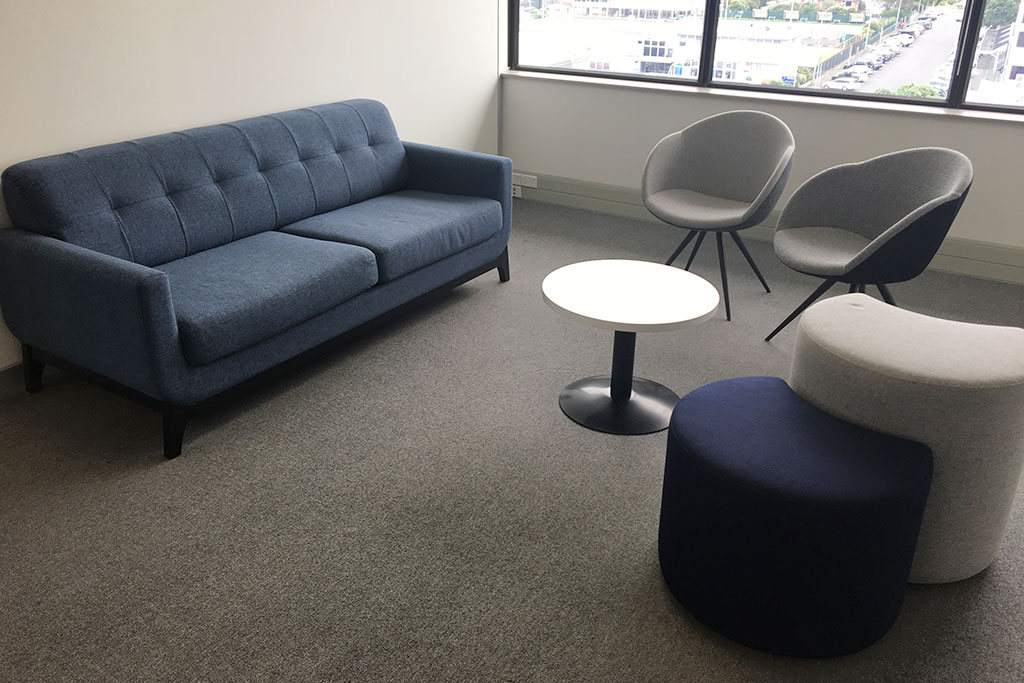 Diplomat Global breakout area with sofa and informal seating