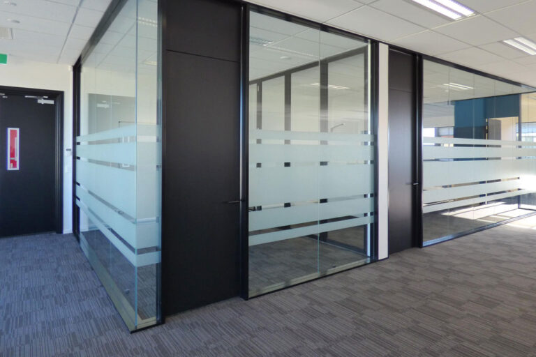 Finished Focus Group office fit-out in Christchurch with glazed meeting rooms and enclosed workspaces.